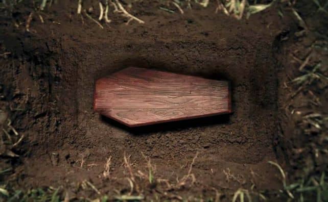 Rêver de cercueil dans une tombe